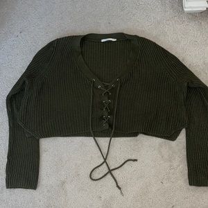 dark green sweater with laces